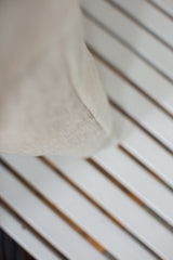 Pillow with a subtly textured European linen grey back and neat seam.