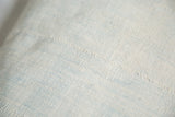 Faded Powder Blue Indigo Pillow, showcasing woven texture, faint blue hues, and stitched lines.