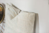 Corner detail of Faded Powder Blue Indigo pillow, highlighting sun-faded vintage textile.