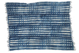 Vintage African hand-dyed indigo textile throw with unique denim blue and ivory design.