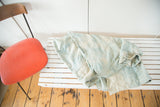 Supple hand-dyed African indigo textile with ivory and powder blue color variations.