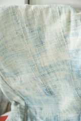 Supple hand woven African textile in powder blue and light blue cotton with textural paneled seams.