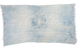 Vintage African hand-woven textile throw in faded indigo and ivory, with tassels.