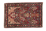 Antique Kerman rug mat with a unidirectional tree of life motif in magenta, cream, and blue hues.