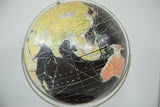 Circa 1960s Rand McNally black globe, with Asia and Australia in yellow, green, orange.