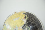 Vintage 1960s black globe with detailed Pacific Ocean grid and yellow Asian land.