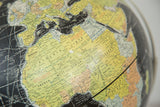Vintage 1960s Rand McNally black globe detail showing map of Europe and Africa.