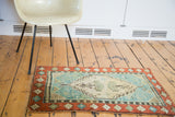 Antique Oushak rug mat with Caribbean blue field, earthy orange border, playful geometric motifs.