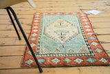 Antique Oushak rug mat corner with coral border, playful motifs, and soft, full pile.
