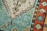 Intricate geometric patterns of a circa 1930s Oushak rug's Caribbean blue field and border.