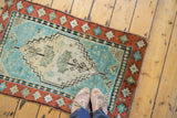 Plush, hand knotted pile of an Oushak rug in Caribbean blue and soft terracotta.