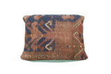 Hand-knotted antique Kazak rug fragment pillow, rust and indigo geometric patterns, faded turquoise linen back, 14x16 inches.