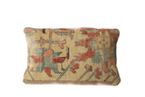 Antique Yellow Serapi rug fragment pillow with age-worn geometric red and teal motifs.