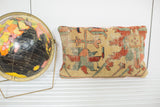 Antique Yellow Serapi rug fragment pillow with muted Persian motifs and visible patina.