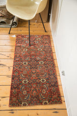 Collector quality antique Bijar fragment rug, hand-knotted, intricate red, blue, cream pattern.