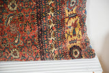 Antique Bijar floor pillow, late 19th century Persian rug design: red, yellow, ivory.