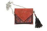 Reddish-brown suede rug fragment purse featuring vintage Northwest Persian purple and red pattern.