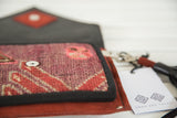 Open Rug Fragment Purse showing geometric purple and red vintage Northwest Persian rug pattern.