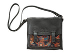 Handmade leather messenger bag with antique dark blue Kazak geometric rug fragment.