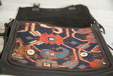 Geometric red and blue antique Caucasian Kazak rug fragment with metal snap.
