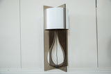 Modern handmade Tucker lamp with a smoked acrylic base and white reversible shade.