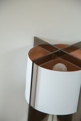 Handmade Tucker Lamp with white reversible shade, dark acrylic top, warm interior.