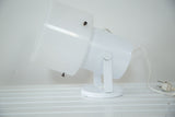 Vintage 1960s white spotlight desk lamp with translucent acrylic cap, 9x7x6 inches.
