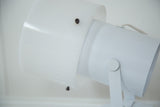 White acrylic cap attached to metal housing of vintage spotlight desk lamp.