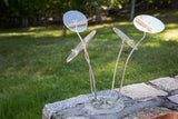 Vintage 1960s Lucite hat stand with iridescent chrome arms and clear acrylic discs.