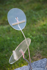 Upper clear acrylic discs and chrome stem of the vintage 1960s hat stand.