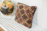 Geometric pattern of the antique late 19th century Turkmen rug fragment pillow in deep brown and khaki.