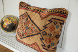 Geometric Serab pattern on plush camel hair vintage floor pillow in natural brown, blue, and red.