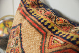 Plush camel hair pile of a vintage Serab floor pillow, showing geometric motifs.