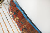 Textured antique Caucasian Kazak rug fragment with geometric motifs and cobalt blue velvet back.