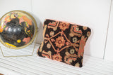 Antique Northwest Persian rug fragment pillow with charcoal and peach geometric patterns, 13x16.