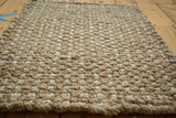 Durable natural fiber texture of the hand braided beige entrance mat.