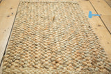 Braided texture of natural gold hemp, jute, and sisal entrance mat.