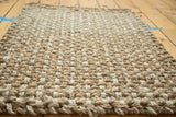 Durable hand-braided weave texture, featuring natural beige and cream tones.