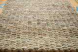 Tightly hand braided natural fiber texture of the durable entrance mat.