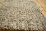 Hand braided texture of the natural hemp, jute, and sisal entrance mat.