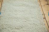 Plush, hand woven cream shag pile texture of the Moroccan bath rug.