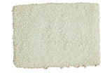 Rectangular hand-woven Moroccan shag bath mat in creamy off-white, plush texture, 2' x 2'10