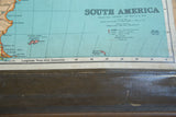 Map legend and scale detail above the textured, stitched bottom of the antique wall map.