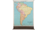 Antique Nystrom pull-down map of South America showing pastel-colored countries and blue oceans.