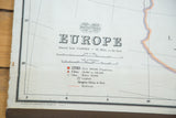 Antique Nystrom map detail of 'EUROPE' title, logo, scales, and legend information.