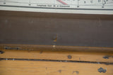 Small tear on brown backing of vintage Nystrom map, 'UNRIVALED' on wooden roller.