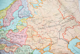 Vintage Nystrom Europe map, showing Soviet Socialist Union text and aged paper.