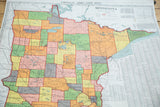 Vintage 1930s Nystrom pull-down Minnesota map with pastel eastern counties and index.