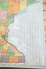 1930s Minnesota pull down map detail showing Lake Superior, eastern counties, and city index.
