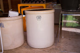 Antique cream stoneware crock with a dark keystone 8 gallon stamp, 14 inches tall.